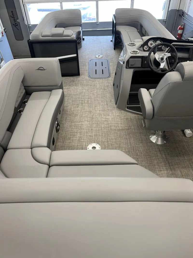 Slide: The Image of Interior of 2025 SunCatcher Fusion 322C pontoon boat with luxurious seating and modern helm. - 6