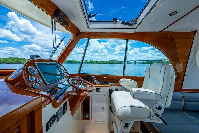 Slide: The Image of Interior of 2016 Hinckley Picnic Boat 37 MKIII with luxurious helm and scenic view. - 10