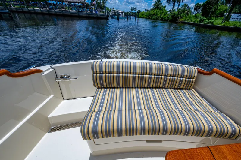 Slide: The Image of Hinckley Picnic Boat 37 MKIII, 2016, striped seating, cruising on a scenic waterway. - 19