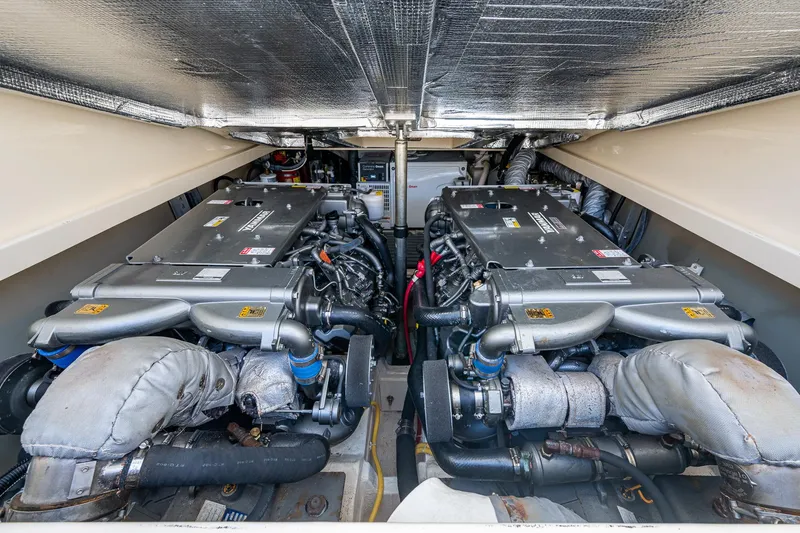 Slide: The Image of Engine room of 2016 Hinckley Picnic Boat 37 MKIII, showcasing dual engines. - 20