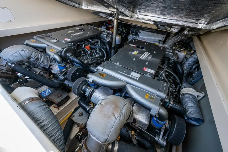 Slide: The Image of Engine room of 2016 Hinckley Picnic Boat 37 MKIII with twin engines and mechanical components. - 21