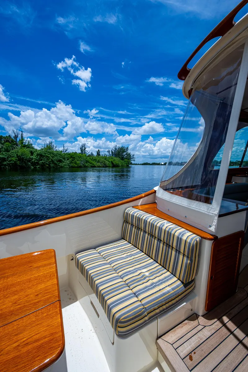Slide: The Image of Hinckley Picnic Boat 37 MKIII, 2016, with striped seating, cruising on a sunny day. - 5
