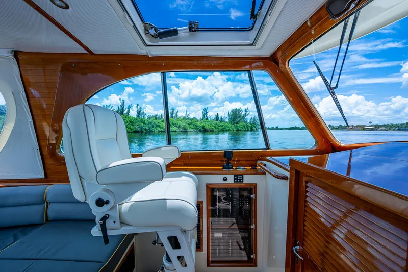 Slide: The Image of Interior of 2016 Hinckley Picnic Boat 37 MKIII with scenic water view. - 8