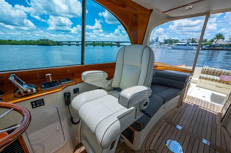 Slide: The Image of Interior of 2016 Hinckley Picnic Boat 37 MKIII with luxurious seating and scenic water view. - 9