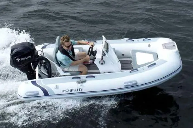 The Image of 2024 Highfield Classic 340 GT boat cruising on water with Tohatsu outboard motor. - 0