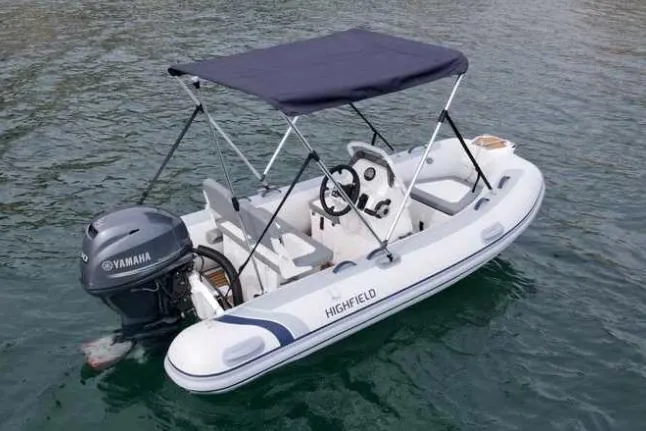 Slide: The Image of 2024 Highfield Classic 340 GT boat with Yamaha engine on water. - 1