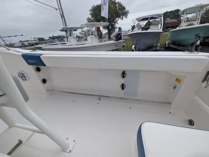 Slide: The Image of 2025 Robalo R222 Explorer boat interior with seating and storage compartments. - 24