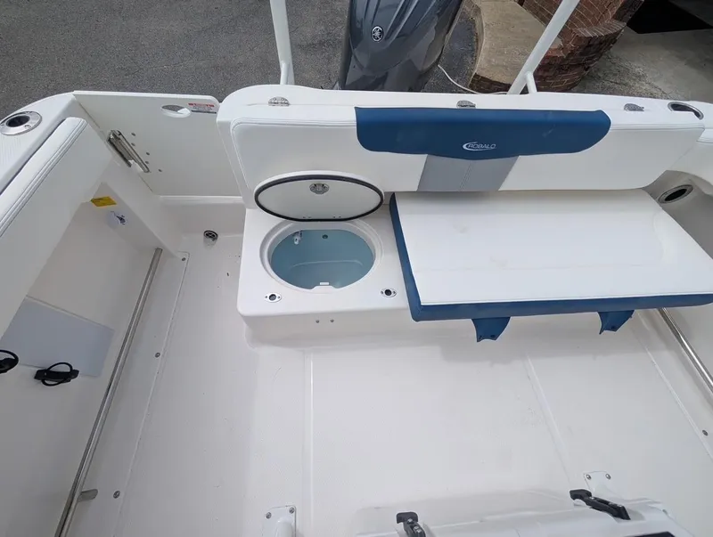Slide: The Image of 2025 Robalo R222 Explorer boat interior with seating and storage compartments. - 28