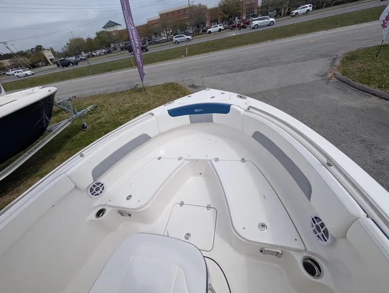 Slide: The Image of 2025 Robalo R222 Explorer boat interior with seating and storage compartments. - 34