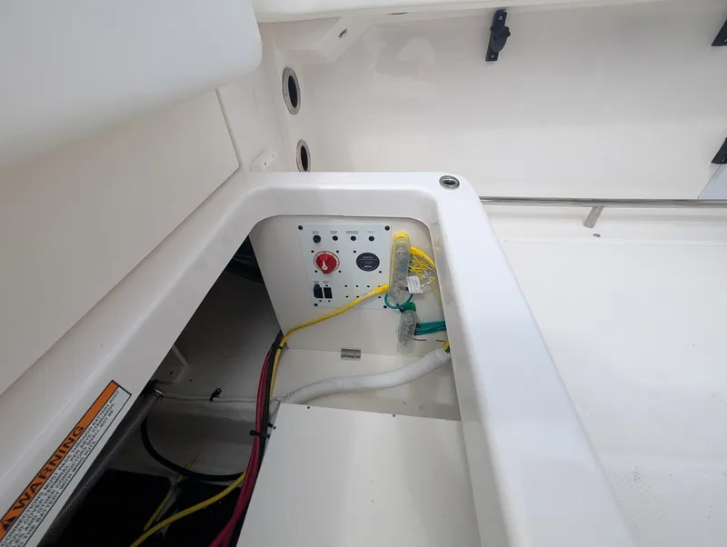 Slide: The Image of 2025 Robalo R222 Explorer boat interior wiring and control panel. - 37