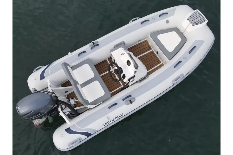 Slide: The Image of 2024 Highfield Classic 360 GT inflatable boat on water, featuring sleek design and modern seating. - 2