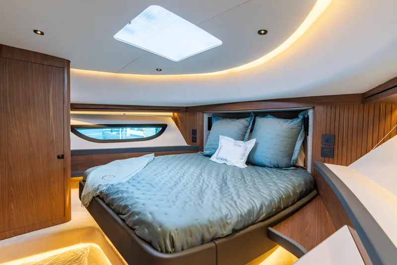 Slide: The Image of Luxurious interior of 2025 ECLIPSE 505 Shadow yacht with elegant bedding and ambient lighting. - 10