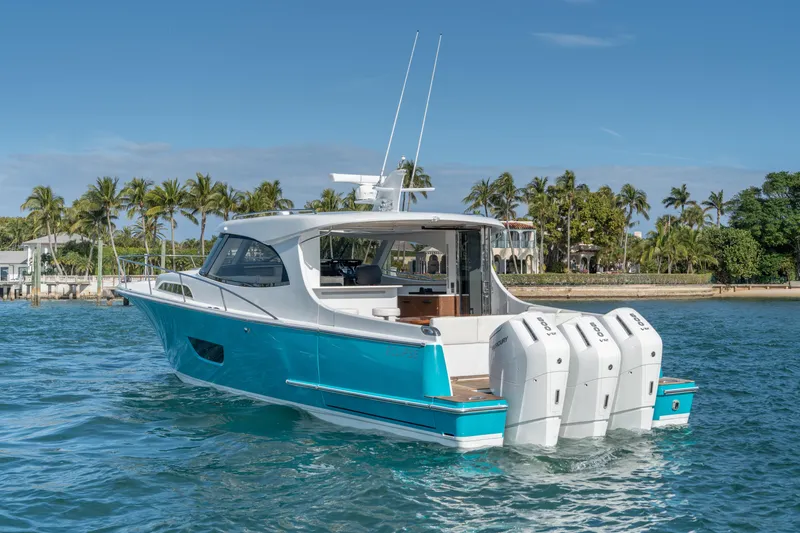 Slide: The Image of 2025 ECLIPSE 505 Shadow boat on water, featuring sleek design and powerful engines. - 15