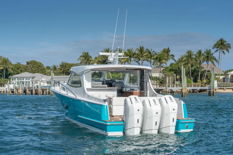 Slide: The Image of ECLIPSE 505 Shadow 2025 boat with triple engines on tropical water. - 16