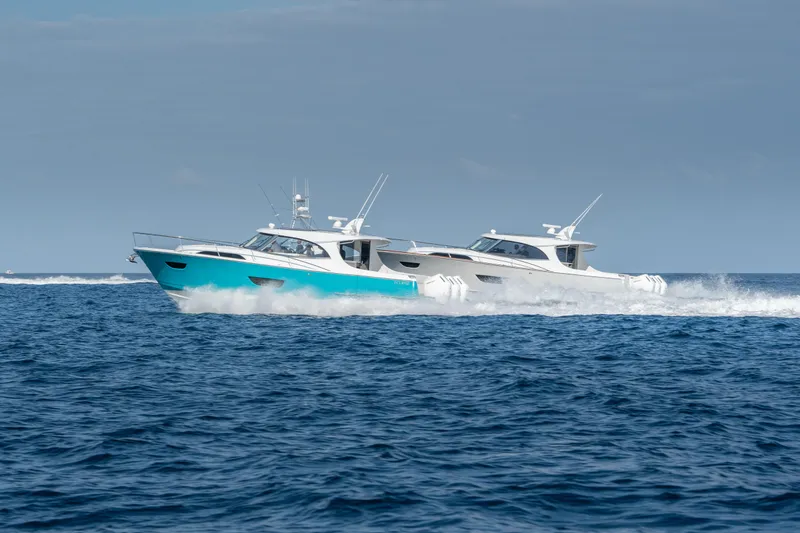 Slide: The Image of Two ECLIPSE 505 Shadow boats cruising on open water, 2025 model. - 19