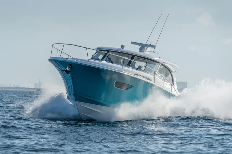 Slide: The Image of 2025 ECLIPSE 505 Shadow yacht cruising swiftly on open water. - 22