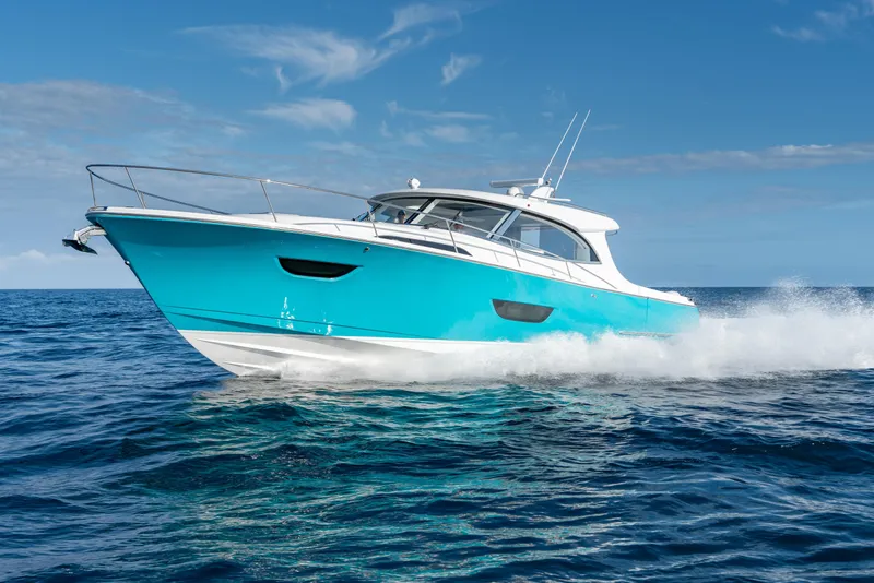 Slide: The Image of 2025 ECLIPSE 505 Shadow yacht cruising on open sea under clear skies. - 24