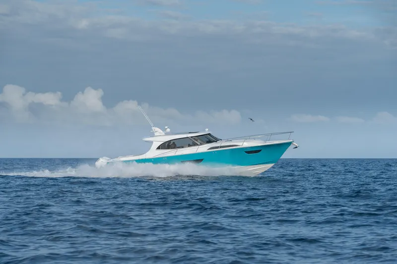 Slide: The Image of 2025 ECLIPSE 505 Shadow yacht cruising on open sea under clear sky. - 25