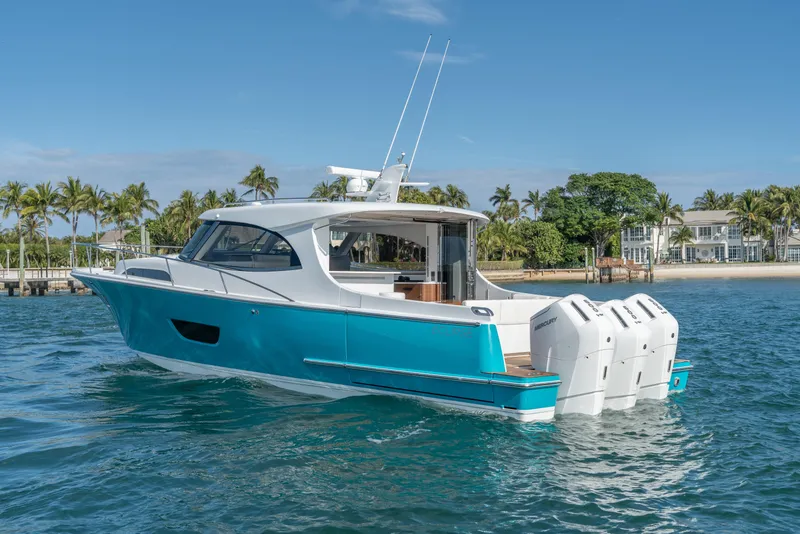 Slide: The Image of 2025 ECLIPSE 505 Shadow yacht on blue water, tropical background. - 4