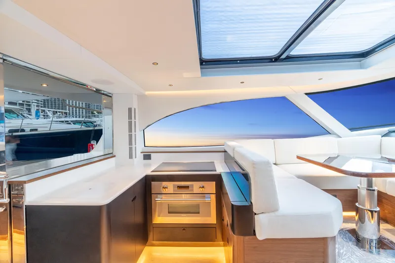 Slide: The Image of Luxurious interior of 2025 ECLIPSE 505 Shadow yacht with modern kitchen and seating area. - 5
