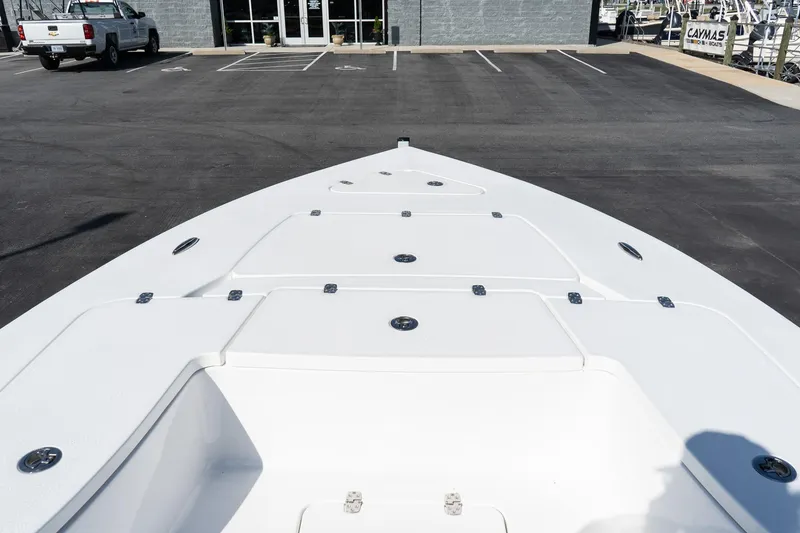 Slide: The Image of Bow view of 2026 Blazer 675 Ultimate Bay boat in parking lot. - 12