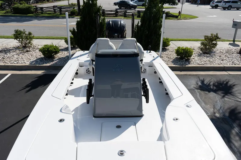 Slide: The Image of 2026 Blazer 675 Ultimate Bay boat, sleek design, parked outdoors, showcasing modern features. - 13