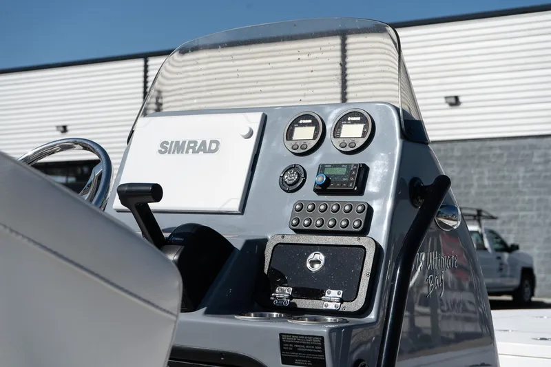 Slide: The Image of Control panel of 2026 Blazer 675 Ultimate Bay boat with Simrad electronics. - 16