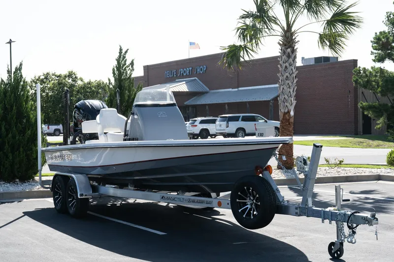 Slide: The Image of 2026 Blazer 675 Ultimate Bay boat on trailer outside Neuse Sport Shop. - 2