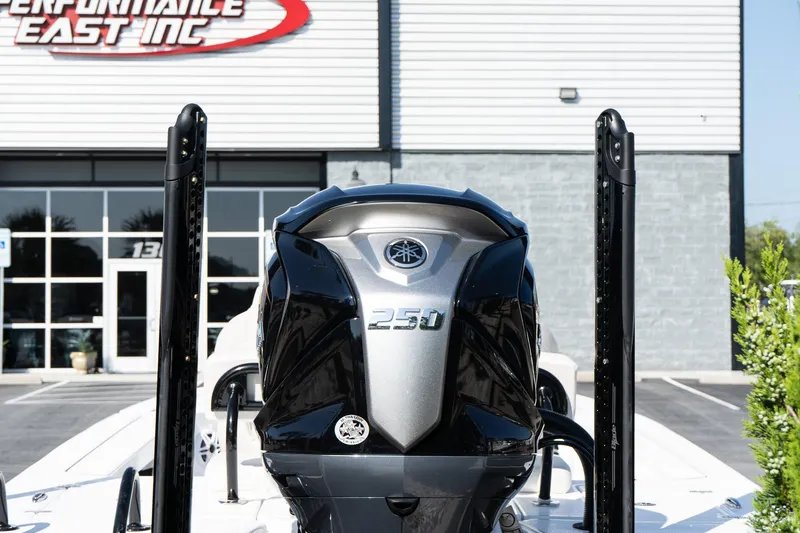 Slide: The Image of 2026 Blazer 675 Ultimate Bay boat with powerful 250 engine at dealership. - 5