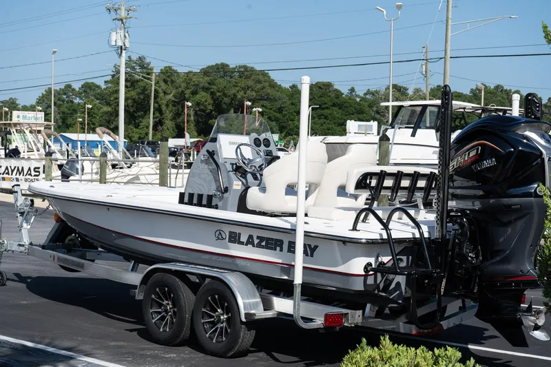 Slide: The Image of 2026 Blazer 675 Ultimate Bay boat on trailer, featuring Yamaha outboard motor. - 6