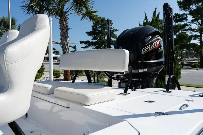 Slide: The Image of 2026 Blazer 675 Ultimate Bay boat with white seating and powerful engine. - 7