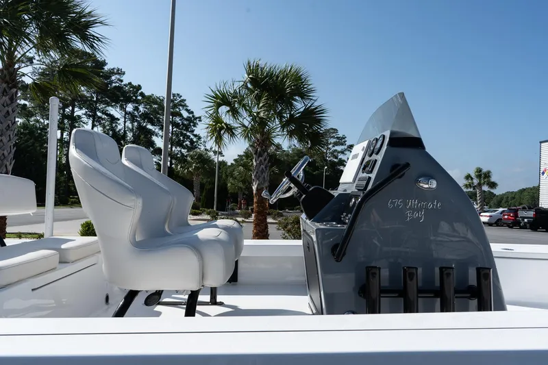 Slide: The Image of 2026 Blazer 675 Ultimate Bay boat with sleek console and white seating. - 9