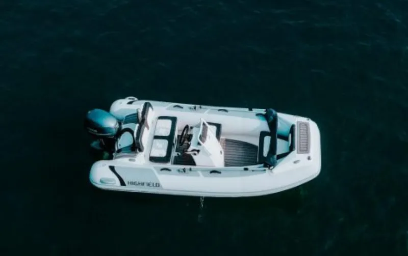 Slide: The Image of 2025 Highfield Sport 360 boat on dark water, aerial view. - 3