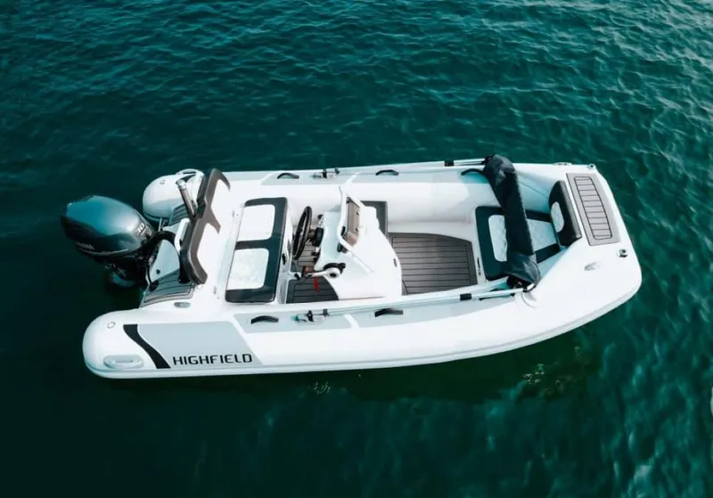 Slide: The Image of 2025 Highfield Sport 360 boat on clear blue water, top view. - 5