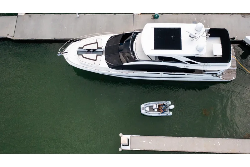 Slide: The Image of Aerial view of a Highfield Classic 380 FCT beside a yacht. - 7