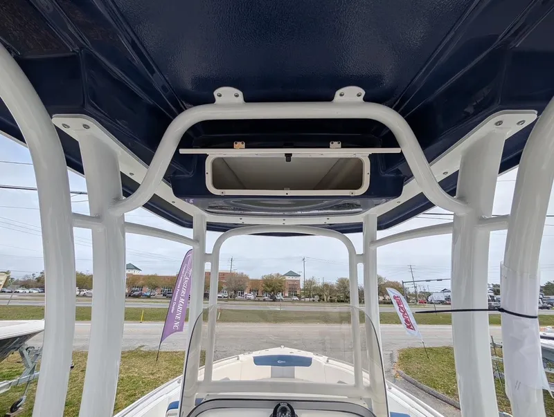 Slide: The Image of 2025 Robalo R222 Explorer boat interior, showcasing sturdy framework and open hatch. - 30
