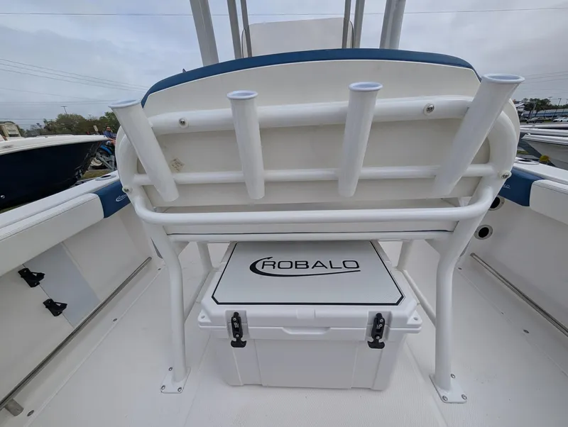 Slide: The Image of 2025 Robalo R222 Explorer boat interior with rod holders and storage compartment. - 32