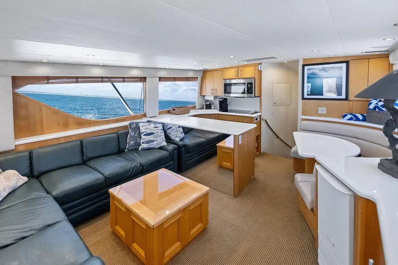 Slide: The Image of Luxurious interior of 1998 Hatteras 60 Convertible yacht with ocean view. - 32