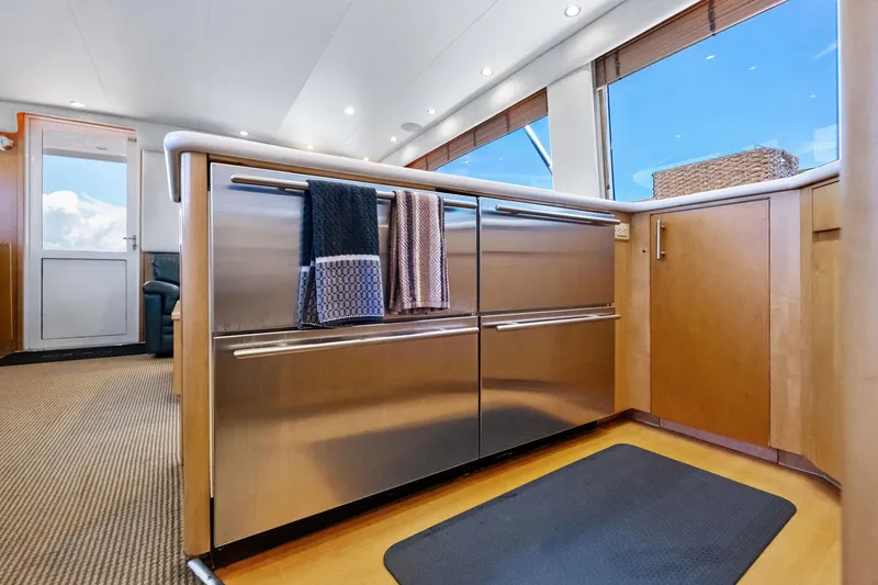 Slide: The Image of Interior of 1998 Hatteras 60 Convertible yacht kitchen with stainless steel appliances. - 37