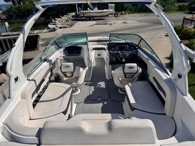 Slide: The Image of 2017 Chaparral 246 SSi boat interior with white seating and adjustable backrest. - 12