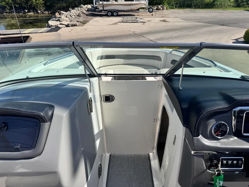 Slide: The Image of 2017 Chaparral 246 SSi boat interior with steering wheel and seating area. - 16