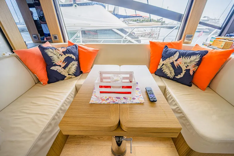 Slide: The Image of Luxurious interior of 2017 Absolute 50 Fly yacht with vibrant cushions and wooden table. - 15