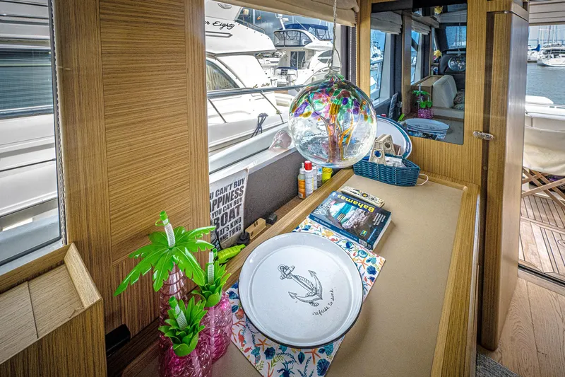 Slide: The Image of Interior of 2017 Absolute 50 Fly yacht with decorative items and marina view. - 16
