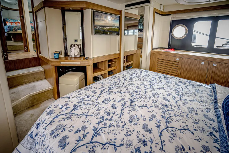 Slide: The Image of Luxurious bedroom interior of 2017 Absolute 50 Fly yacht with elegant decor and natural light. - 24