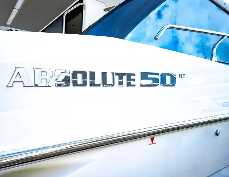 Slide: The Image of Close-up of 2017 Absolute 50 Fly yacht nameplate on white hull. - 33