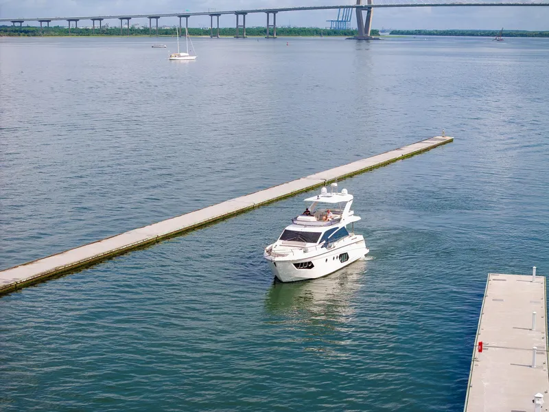 Slide: The Image of Luxury yacht Absolute 50 Fly 2017 cruising near a bridge on a calm waterway. - 37