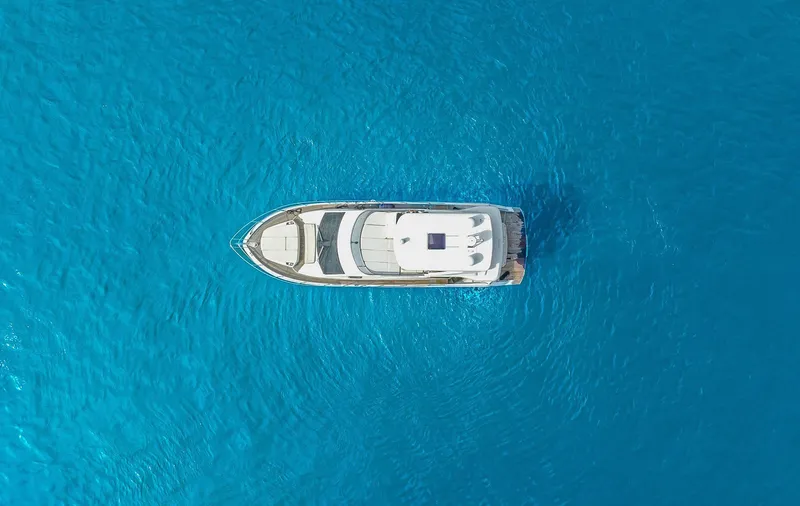 Slide: The Image of Aerial view of 2017 Absolute 50 Fly yacht on clear blue water. - 39