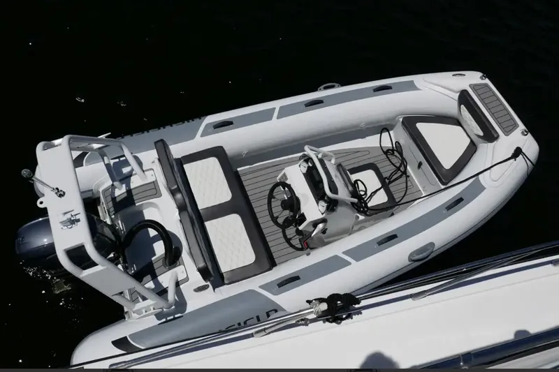 Slide: The Image of 2025 Highfield Sport 420 boat, aerial view, sleek design, white and gray color scheme. - 2