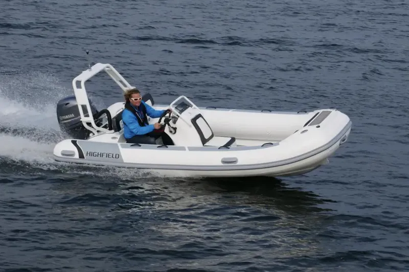 Slide: The Image of 2025 Highfield Sport 460 boat cruising on open water. - 1