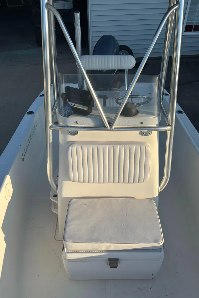 Slide: The Image of 2003 Pioneer 175 Bay Sport boat interior with steering console and seating. - 9
